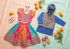 Flat lay of children's pre-loved South Asian festive outfits