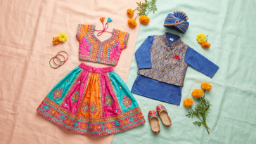 Flat lay of children's pre-loved South Asian festive outfits