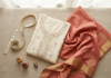 Measuring tape with folded South Asian clothing flat lay