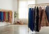 A rail of colourful pre-loved South Asian and modest outfits