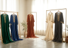 Preloved kaftans and jalabiyas draped on display