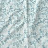 White fabric with blue floral and leaf print