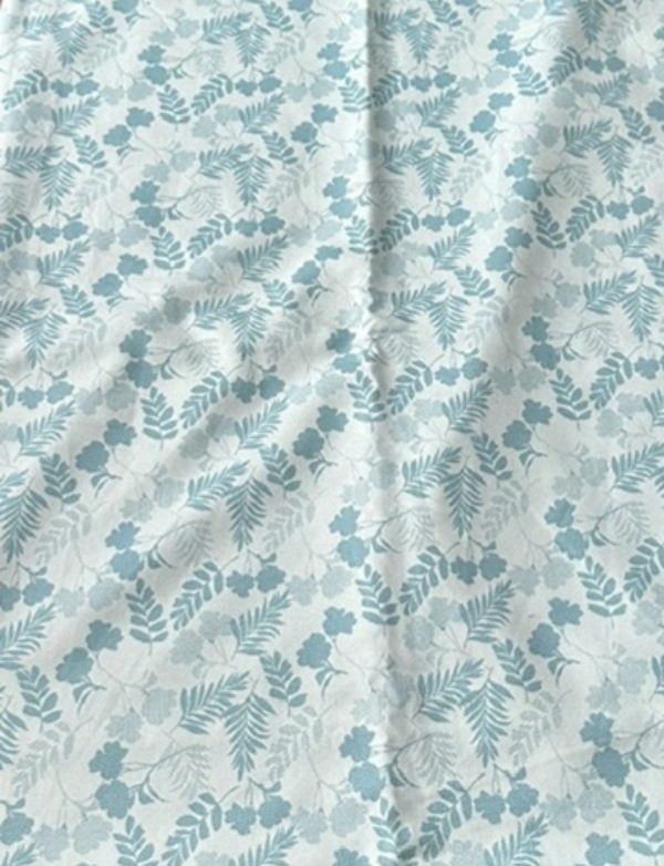 White fabric with blue floral and leaf print