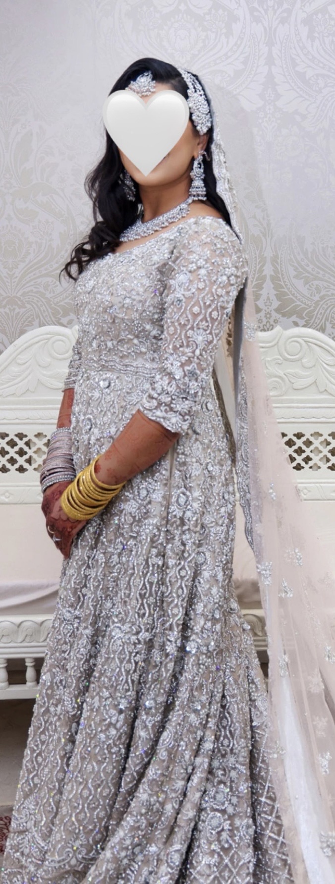Embroidered wedding gown with trail and a long veil
