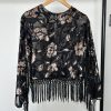 Black sheer burnout floral long sleeve top with fringe hem