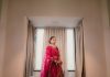 A South Asian bride in a preloved embroidered bridal lehenga