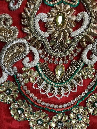 Rust Orange Bridal Lehenga with Gold, Red & Green Embroidery - Image 3