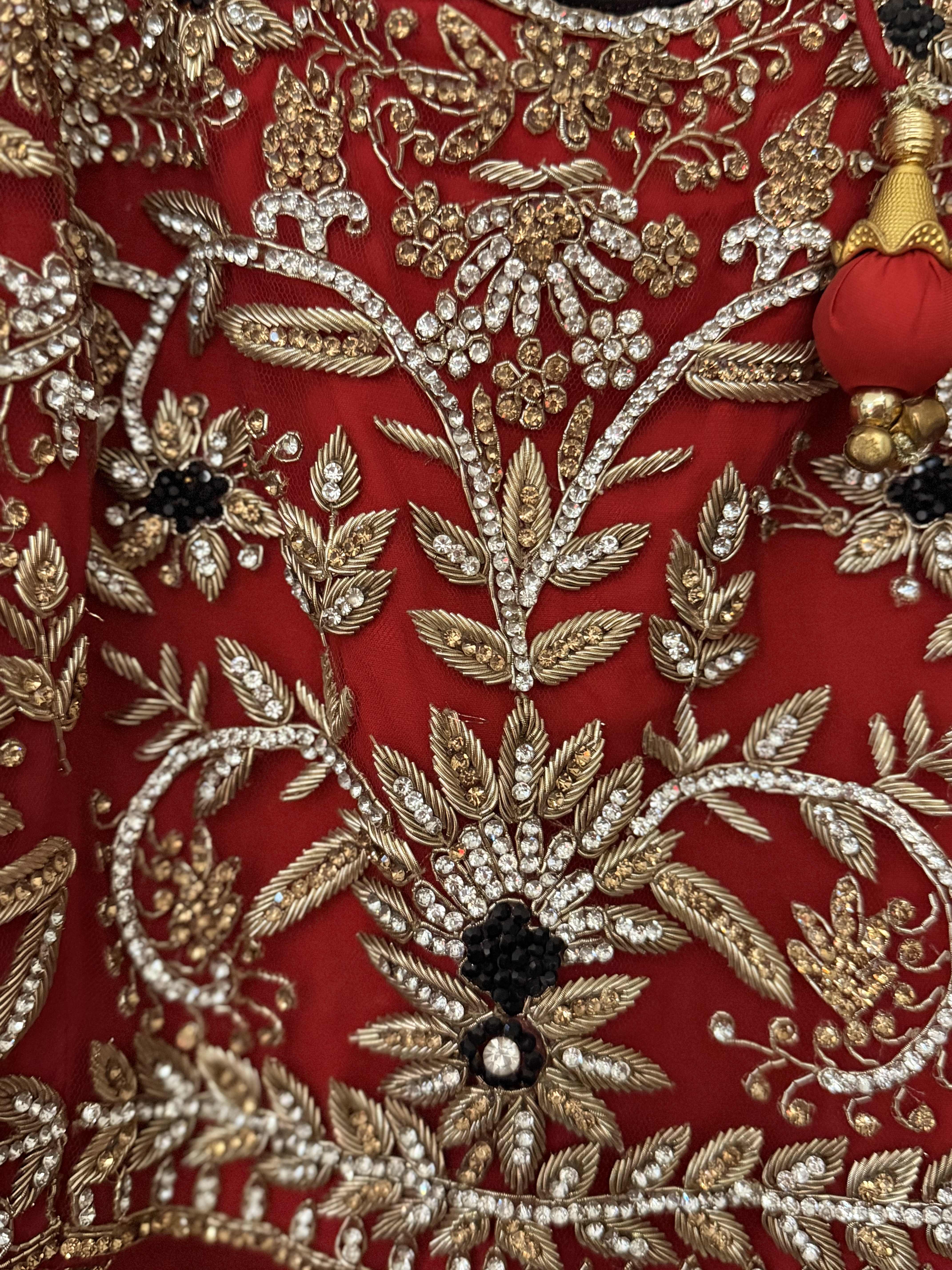 Red Bridal Lehenga with Gold Embroidery and Tassels - Image 2