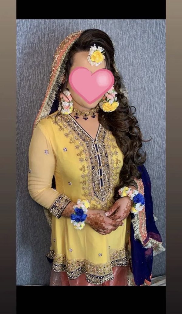 Three piece mehndi bridal outfit with floral jewellery